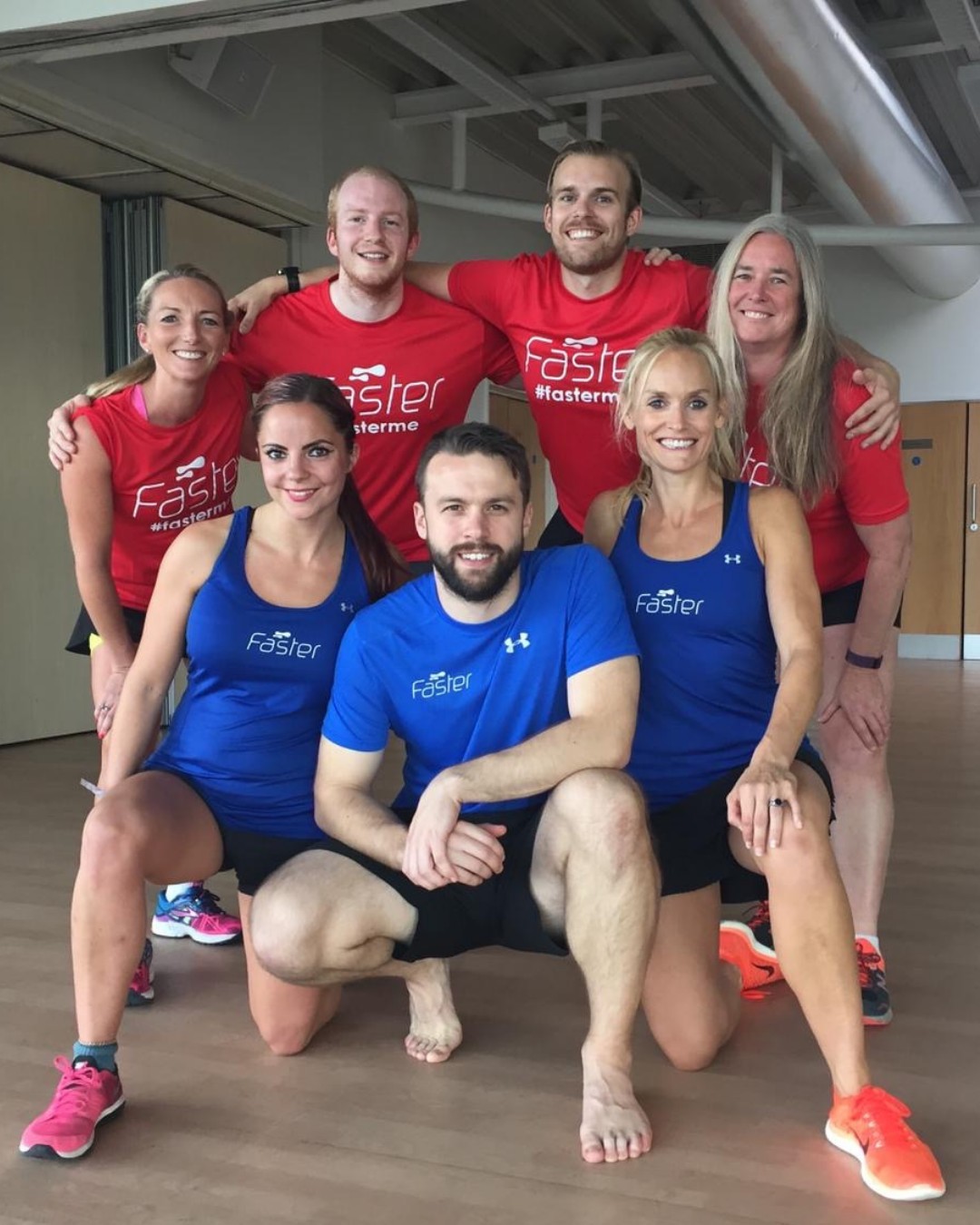 The FASTER team in red and blue FASTER shirts