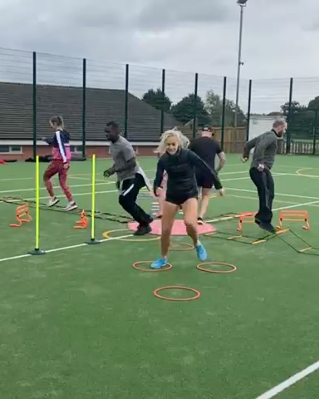 A class weaving through hurdles and rings